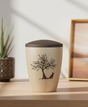 Special pet urn for dogs in beige with a velvety surface and brown lid, adorned with a pad printed motif of a branched tree and a loyal sitting dog silhouette – A dignified keepsake for the home.