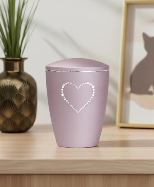 Rosé pet urn with a velvety surface & sparkling glitter heart. Dignified keepsake for your beloved dog or cat. Create a stylish memorial at home – order yours today.